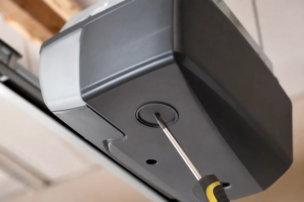 Garage door opener force and travel limit adjustment panel.